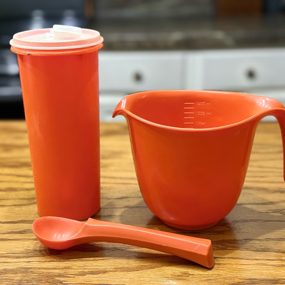 Vintage orange 70s Tupperware lot with measuring cup/bowl and scoop
